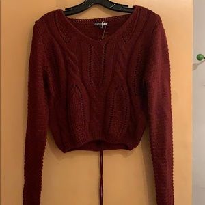 Soft cropped burgundy sweater w/ braided tie back